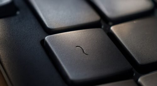 Okay, so I need to talk about a key on your keyboard that you have probably never, ever pressed on purpose. The tilde. That little squiggly line hanging out above your Tab key, next to the 1. For my entire adult life it has existed purely as an accid